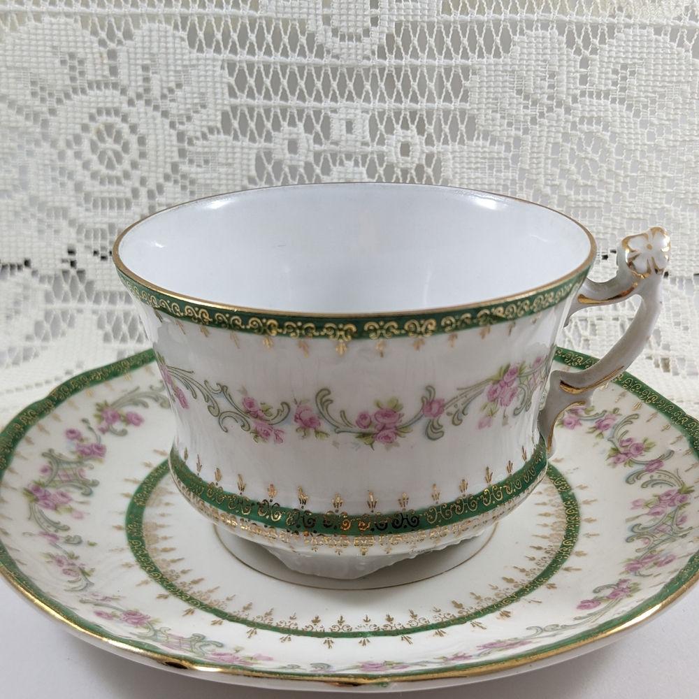 Antique White Porcelain Teacup and Saucer Set with Green and Pink Flower Trim